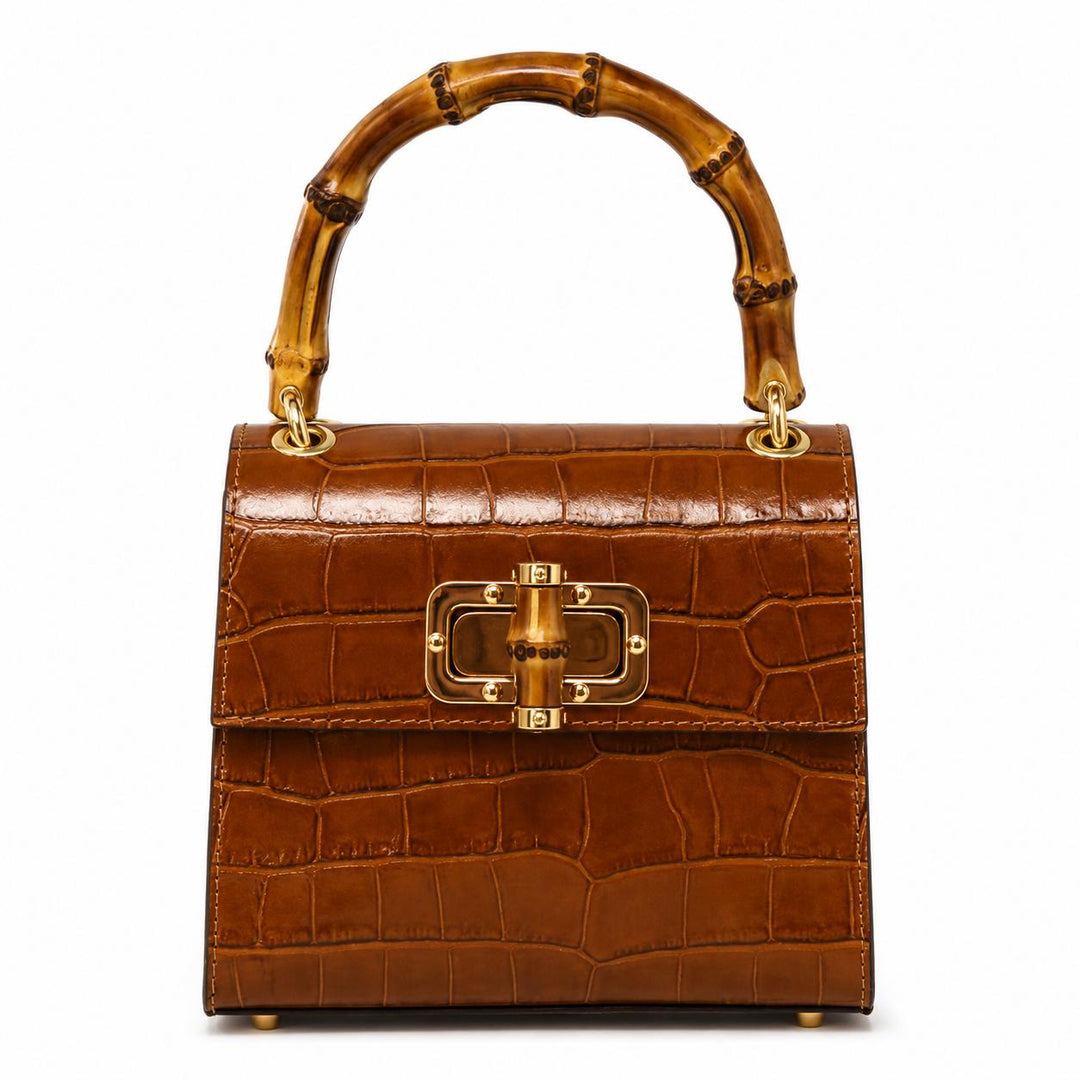 Brown crocodile-embossed leather mini bag with a bamboo top handle and gold-tone bamboo-style clasp closure.