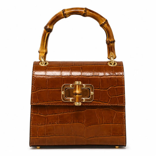 Brown crocodile-embossed leather mini bag with a bamboo top handle and gold-tone bamboo-style clasp closure.