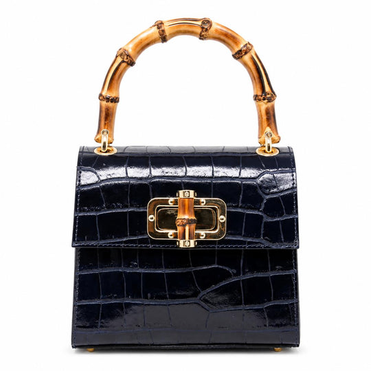 Navy blue crocodile-embossed leather mini bag with a bamboo top handle and gold-tone bamboo-style clasp closure.