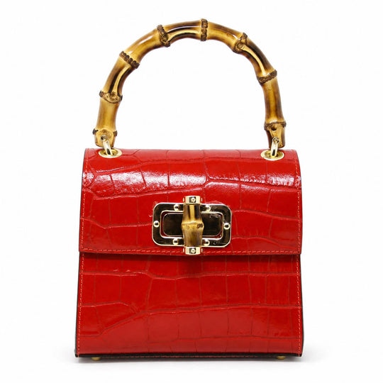 Red mini leather handbag with a crocodile texture, bamboo top handle, and gold-tone clasp closure.