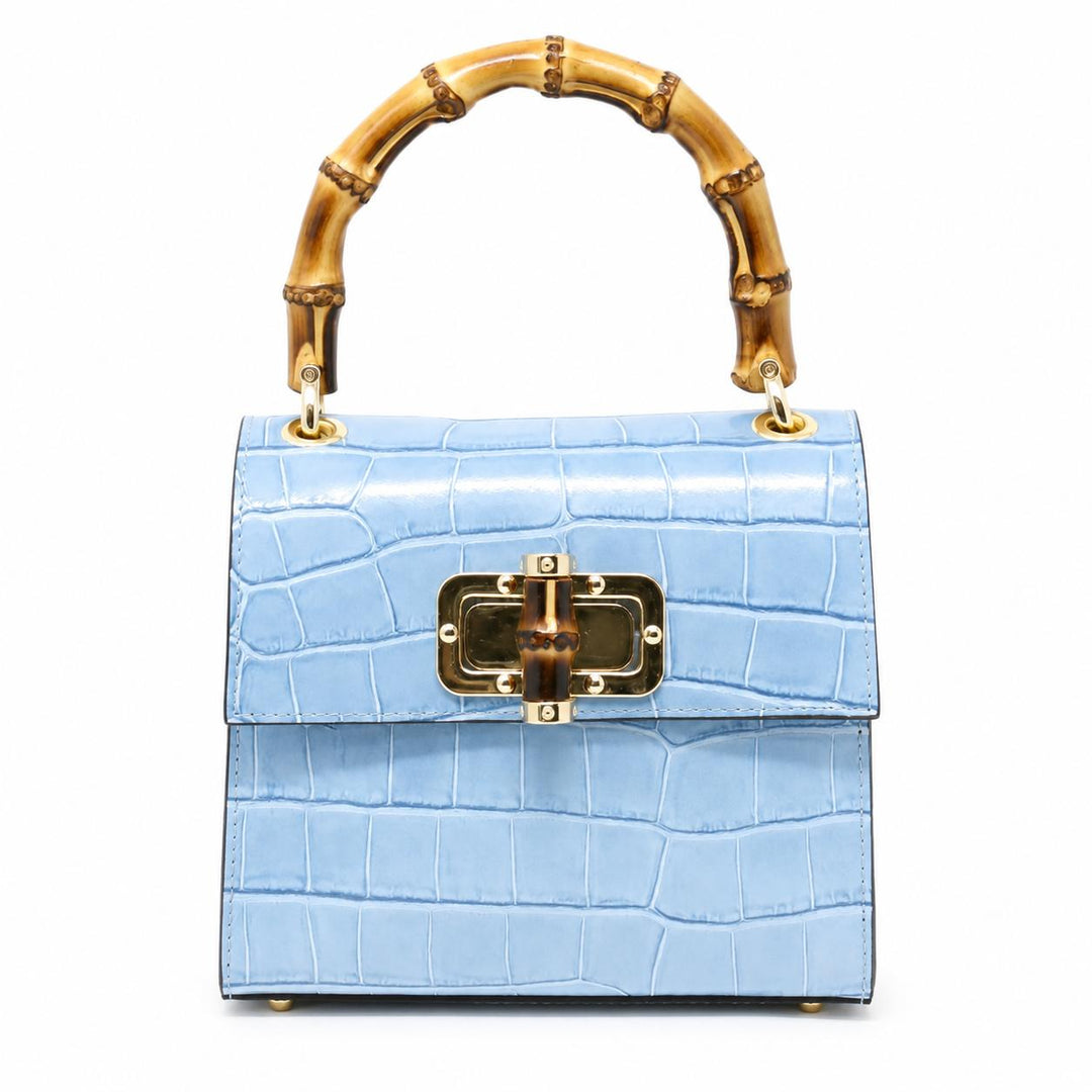 Light blue crocodile-embossed leather mini bag with a bamboo top handle and gold-tone clasp closure.