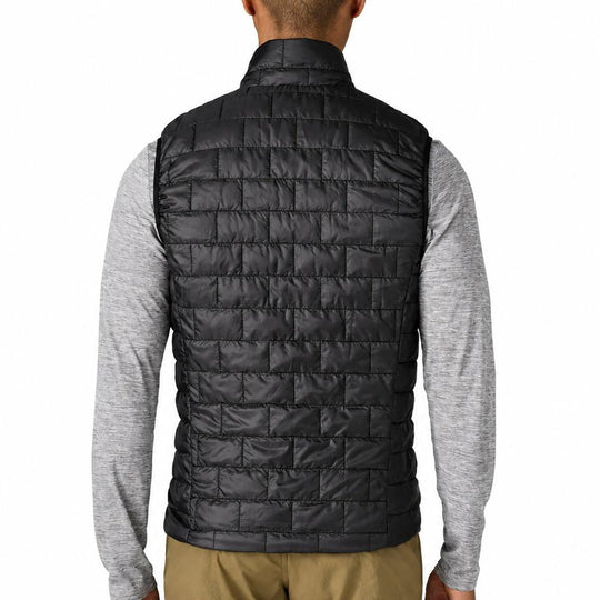 Back view of a black Patagonia Nano Puff vest featuring horizontal brick quilting and a lightweight, insulated design.