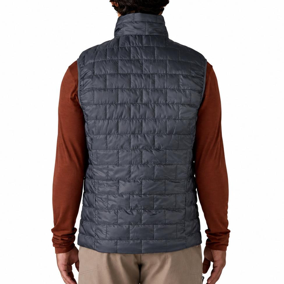 Back view of a charcoal grey Patagonia Nano Puff vest featuring horizontal brick quilting and a lightweight ripstop shell.