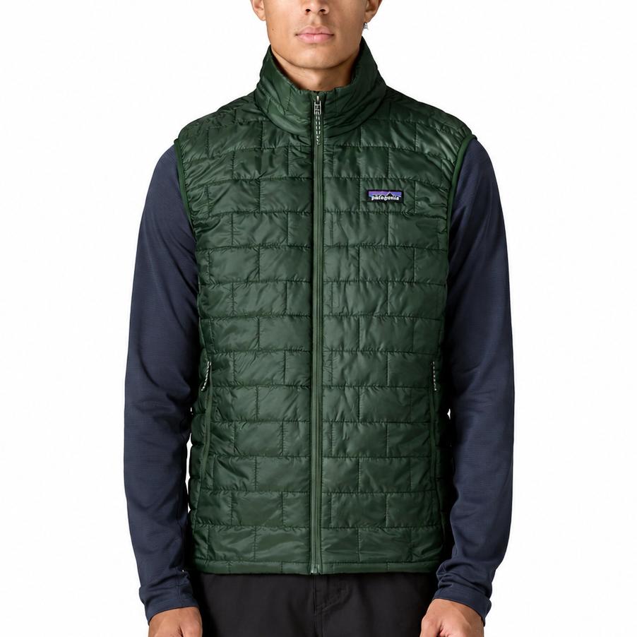 Men's dark green Patagonia Nano Puff vest with horizontal brick quilting, full-zip front, and chest logo patch.