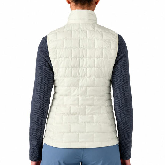 Back view of a cream-colored Patagonia Nano Puff vest featuring a brick quilting pattern and a stand-up collar.