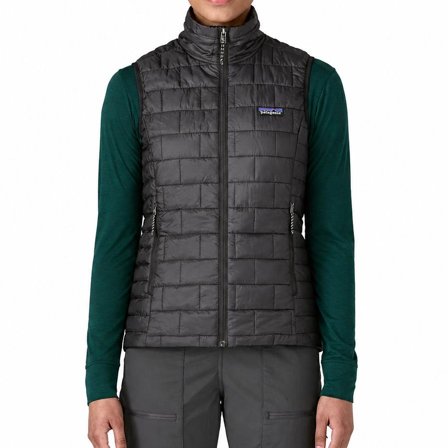 Black Patagonia Nano Puff vest with brick quilting, zip-up front, and stand-up collar worn over a green long-sleeve shirt.