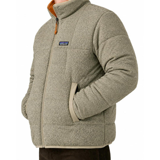 Patagonia men's reversible down sweater in heathered beige knit fleece with a full-zip front and side pockets.