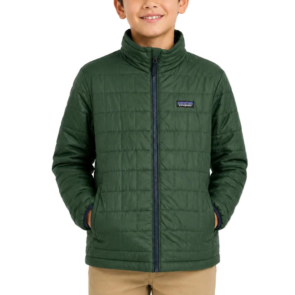 Child wearing a dark green Patagonia Nano Puff brick-quilted jacket with a full-zip front and stand-up collar.