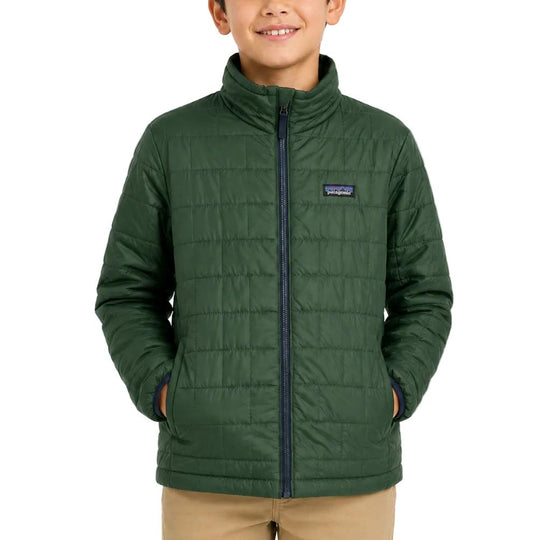 Child wearing a dark green Patagonia Nano Puff brick-quilted jacket with a full-zip front and stand-up collar.