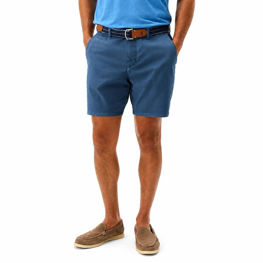 Johnnie-O Nassau garment-dyed blue stretch cotton shorts with a 7-inch inseam and tailored fit.