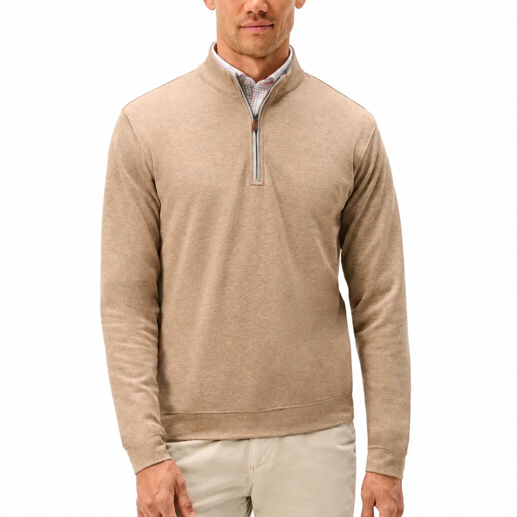 Tan heathered cotton-blend quarter-zip pullover with a leather zipper pull and banded hem worn over a plaid shirt.