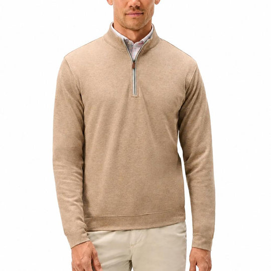Tan heathered cotton-blend quarter-zip pullover with a leather zipper pull and banded hem worn over a plaid shirt.