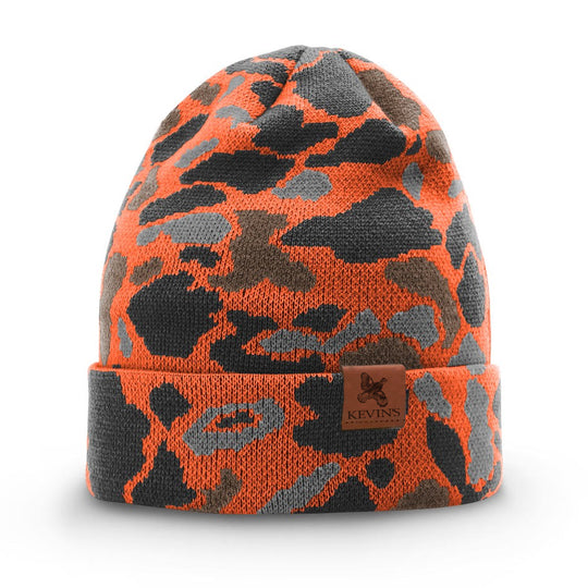 Kevin's duck camo knitted beanie in orange, grey, and brown with a leather logo patch on the cuffed brim.