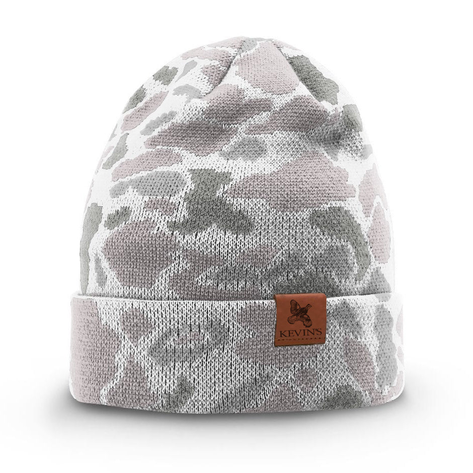 Kevin's duck camo knitted beanie in white and grey with a brown leather logo patch on the cuffed brim.