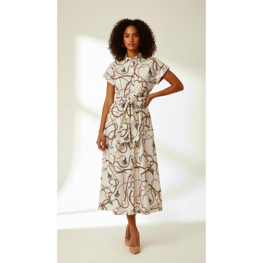 Model wearing a white maxi dress with a brown chain print, short sleeves, button-front, and a matching tie waist belt.