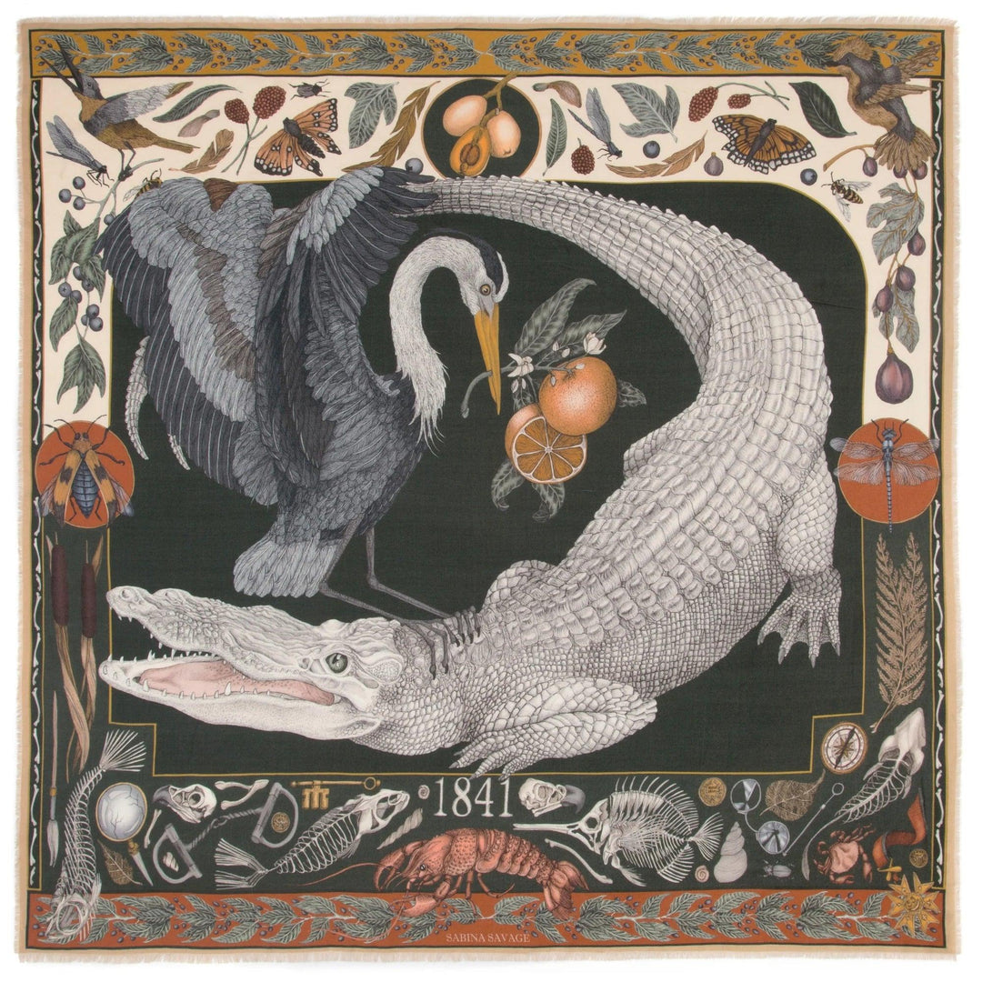 Sabina Savage wool-silk scarf featuring an albino alligator and heron print with hand-fringed edges and botanical borders.