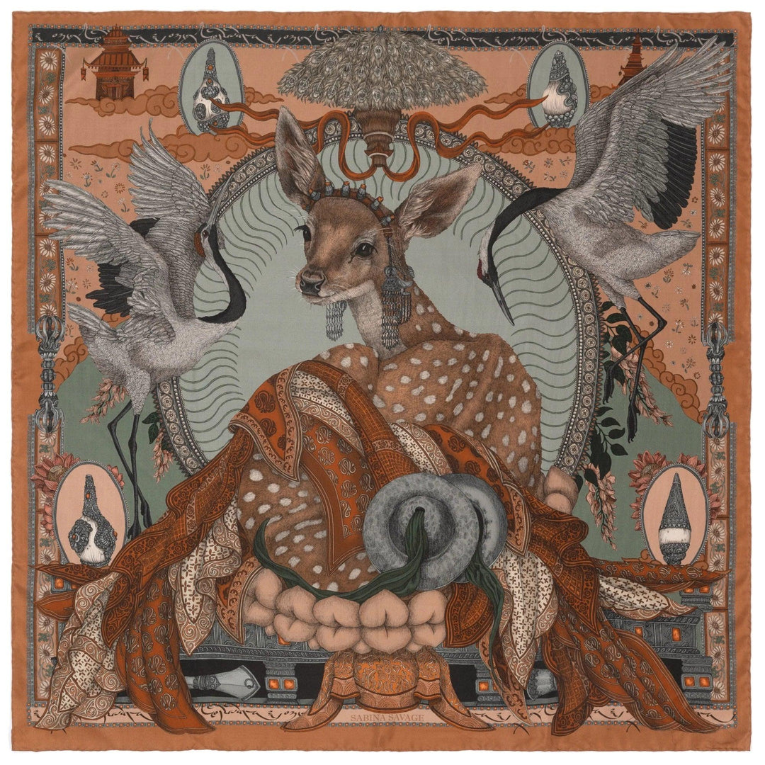 Sabina Savage 35-inch silk scarf featuring a deer, cranes, and Tibetan-inspired motifs in earthy tones with hand-rolled edges.