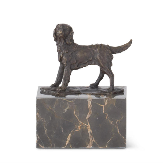 Hand-signed bronze golden retriever sculpture standing on a decorative black marble block base.