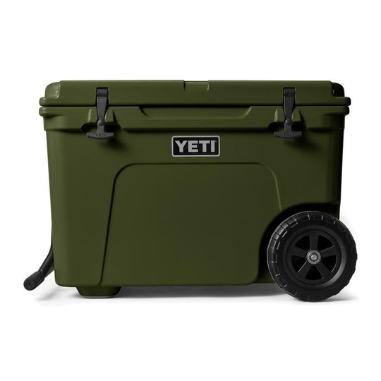 Olive green YETI Tundra Haul wheeled cooler with black T-latches, rugged wheels, and a sturdy side handle.