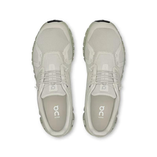Top-down view of light beige On Running Cloud 6 men's sneakers featuring breathable mesh and signature cushioned soles.