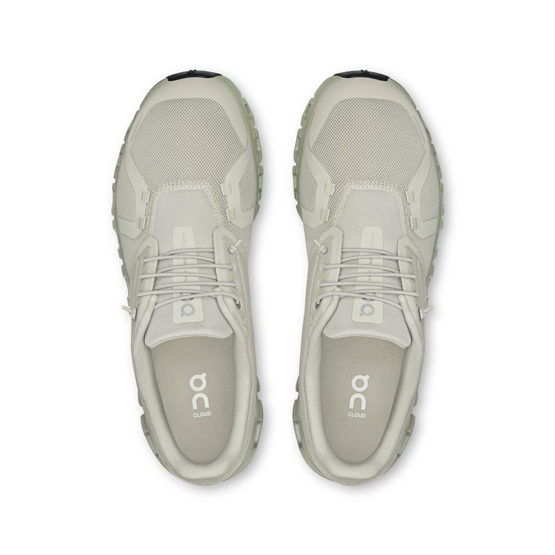 Top-down view of light beige On Running Cloud 6 men's sneakers featuring breathable mesh and speed lacing system.