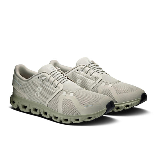 On Running Cloud 6 men's sneaker in light beige with signature CloudTec cushioned sole and breathable mesh upper.
