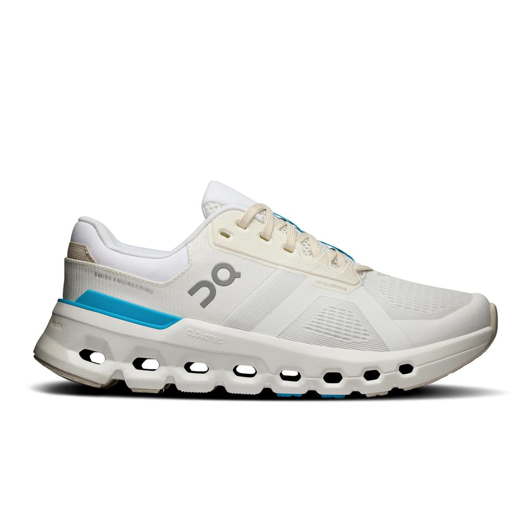 On Running Women's Cloudrunner in cream mesh with blue accents and signature CloudTec cushioned sole.