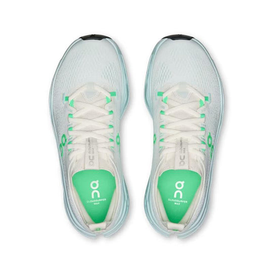 Top view of light blue On Running Cloudsurfer Max women's shoes with bright green accents and cushioned mesh uppers.