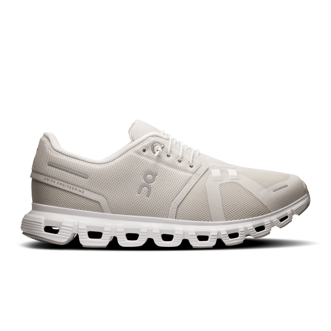 All-white On Running Cloud 6 wide women's sneaker with a breathable mesh upper and signature cushioned sole.