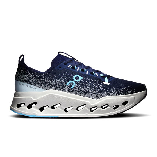 On Running Cloudsurfer Max in navy blue with a white, high-cushion CloudTec Phase midsole and sock-like mesh upper.