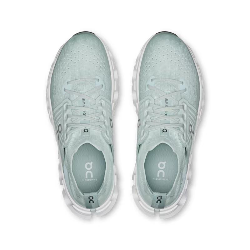 Top-down view of light green On Running Cloudswift 4 women's shoes featuring a breathable mesh upper and white sole.