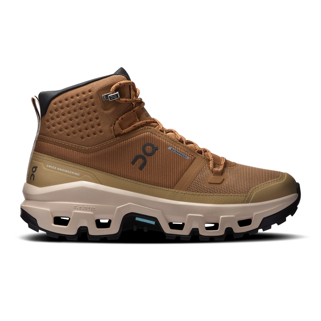 Tan On Running Cloudrock Mid waterproof hiking boot with a rugged Missiongrip outsole and cushioned Helion midsole.