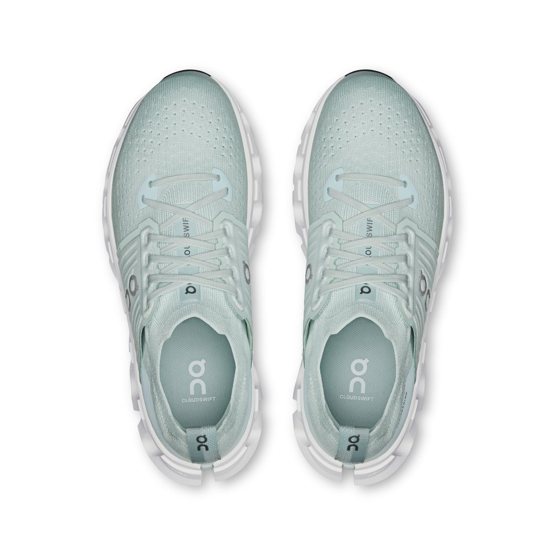 Top-down view of light green On Running Cloudswift 4 women's shoes featuring a breathable mesh upper and white sole.
