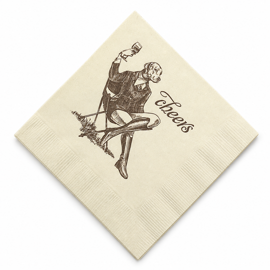 Cream-colored 5-inch 3-ply paper cocktail napkin featuring a whimsical illustration of a dog in a suit with the word cheers.