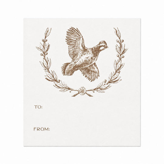 White paper gift sticker featuring a brown ink quail illustration inside a decorative wreath with To and From lines.