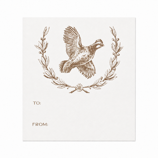 White paper gift sticker featuring a brown ink quail illustration inside a decorative wreath with To and From lines.