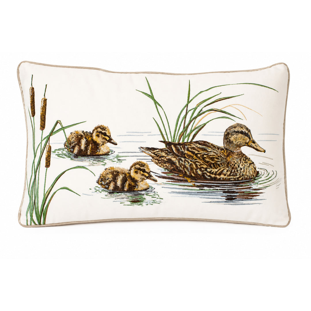 12x21-inch lumbar pillow featuring an embroidered mallard duck and chicks in a pond scene on cream polyester fabric.