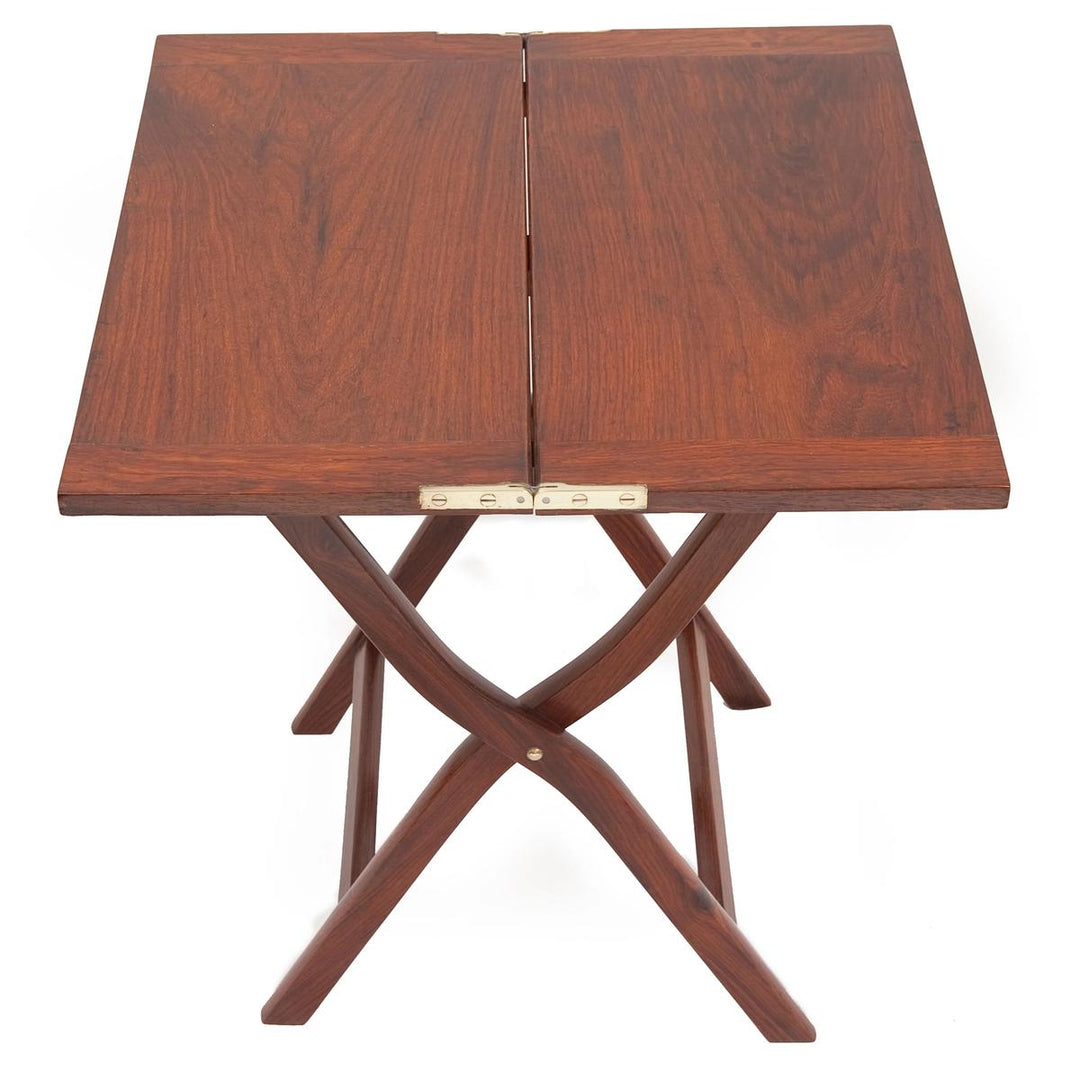 Rosewood campaign folding table with a square top, curved legs, and polished brass hinges.