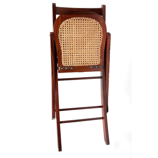 Folded Jaipur polo chair in dark solid rosewood with a natural woven cane seat back.