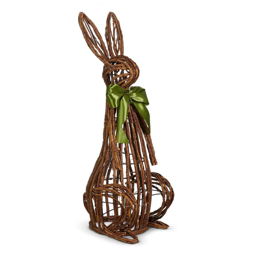 Handcrafted open vine rabbit sculpture made of brown twigs with a decorative green ribbon bow for Easter decor.