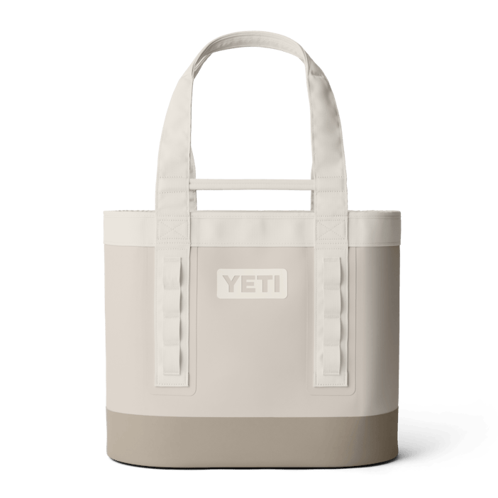YETI Camino Carryall 35 tote in light beige, featuring durable waterproof material, sturdy shoulder straps, and gear loops.