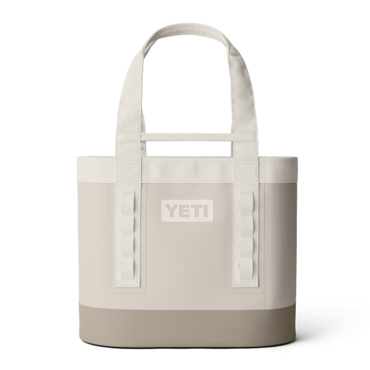YETI Camino Carryall 35 tote in light beige, featuring durable waterproof material, sturdy shoulder straps, and gear loops.
