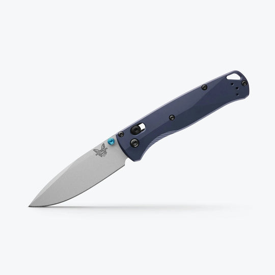 Benchmade Bugout folding knife with a grey drop-point blade, blue thumb stud, and dark blue handle on a white background.