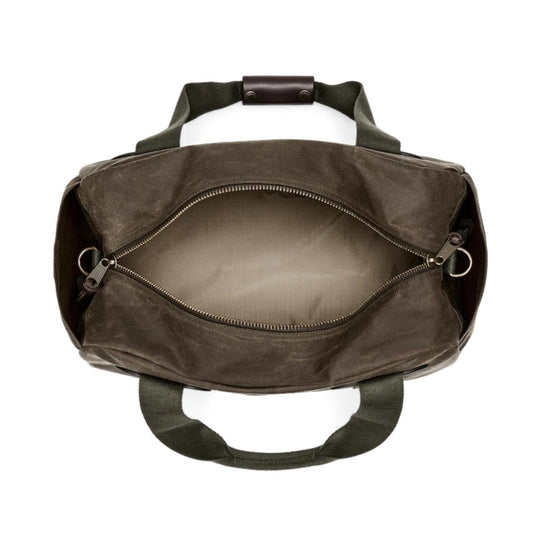 Top view of an open Filson Tin Cloth small duffle bag in olive waxed cotton with a leather handle and nylon lining.