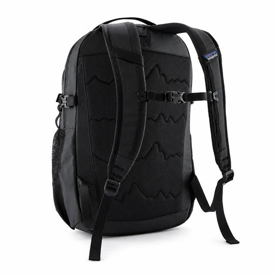 Black Patagonia Refugio 26L daypack showing the breathable mesh back panel, adjustable shoulder straps, and side pocket.