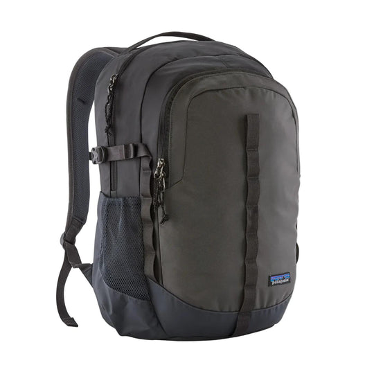 Black Patagonia Refugio 26L daypack with recycled polyester fabric, side mesh pockets, and front gear attachment loops.