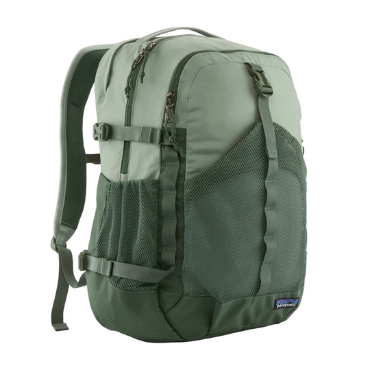 Sage green Patagonia Refugio 30L daypack with mesh front pocket, side water bottle sleeves, and padded shoulder straps.