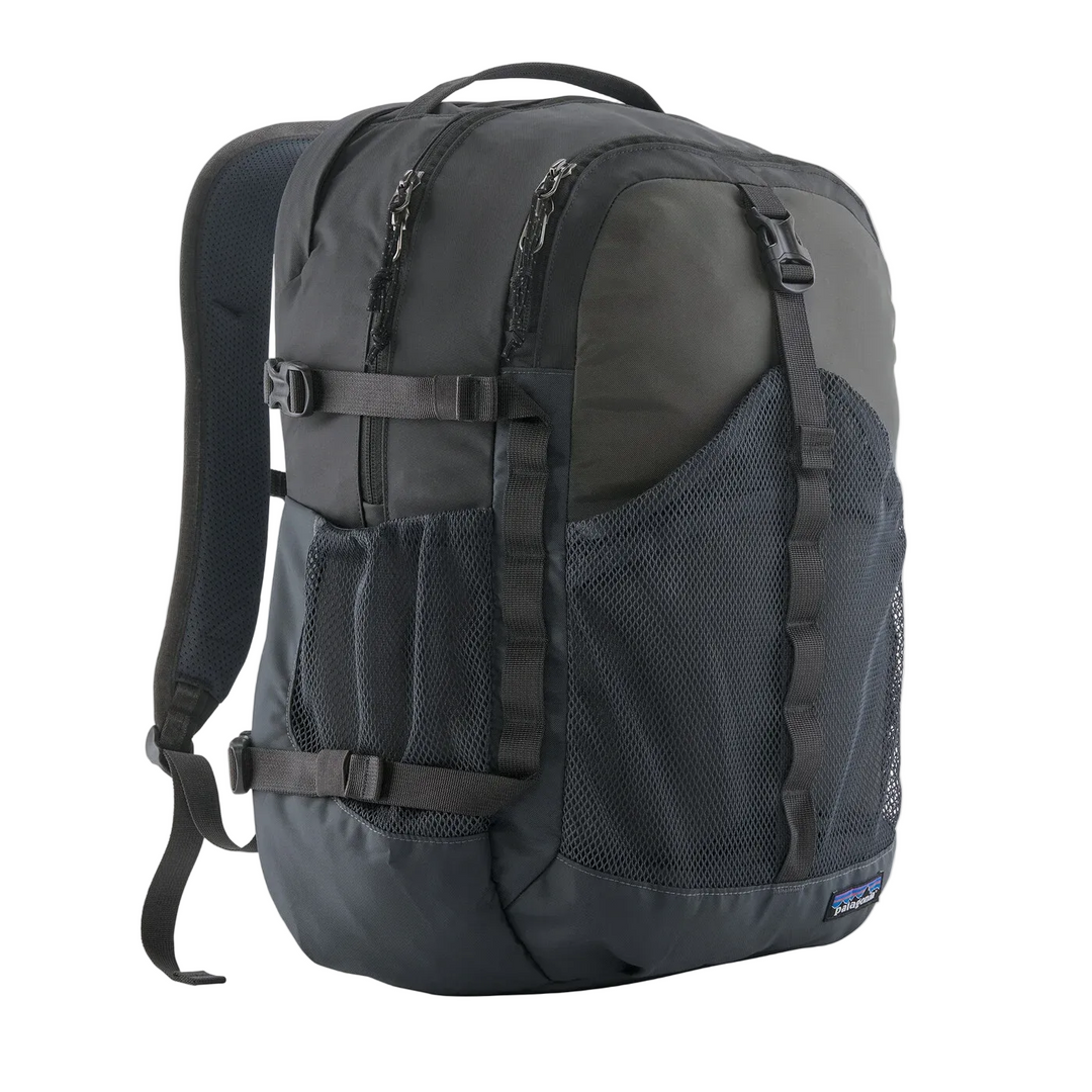 Black Patagonia Refugio 30L daypack with mesh front pocket, side compression straps, and padded shoulder straps.