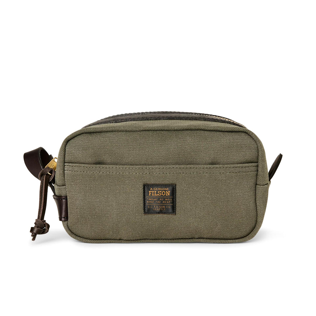 Olive green Rugged Twill travel kit with brown Bridle Leather accents, side carry handle, and brass zipper