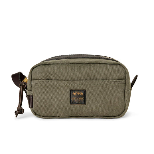Olive green Rugged Twill travel kit with brown Bridle Leather accents, side carry handle, and brass zipper